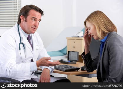 American doctor talking to depressed businesswoman