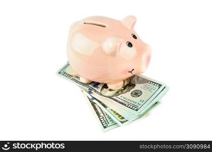 American dollars and piggy bank isolated on white background.