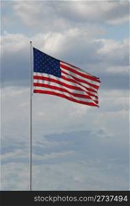 American flag against a cloudy sky