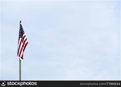 American flag against the blue sky