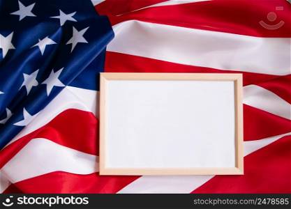 American flag and empty frame for text. Independence, Memorial Day. Concept of celebrating national holidays in the United States. Culture of the USA.. American flag and empty frame for text. Independence, Memorial Day. Culture of the USA.