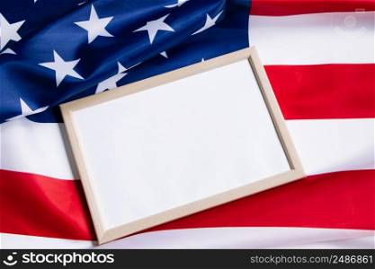American flag and empty frame for text. Independence, Memorial Day. Concept of celebrating national holidays in the United States. Culture of the USA.. American flag and empty frame for text. Independence, Memorial Day. Culture of the USA.