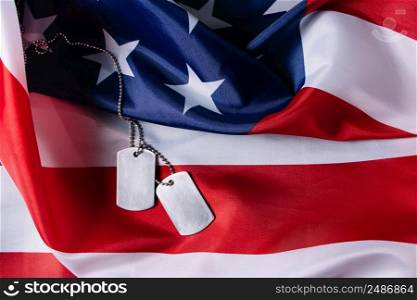 American flag and military dog tags close up. USA Memorial Day concept.. American flag and military dog tags close-up. USA Memorial Day concept.