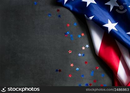 American flag and stars on a dark background. USA national holidays concept. Independence Day, Memorial Day, Labor Day. Place for your text.. American flag and stars on a dark background. USA national holidays concept. Independence Day, Memorial Day, Labor Day.