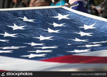 american flag carried at the parade