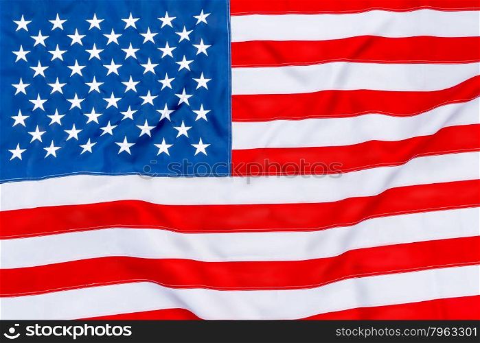 American flag fills the frame completely and fluttering in the wind