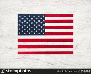 American Flag lying on the table. Place for your inscriptions. Top view, close-up. National holiday concept. American Flag. Beautiful, bright card. Top view