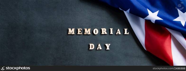 American flag on a dark background. USA Memorial Day concept. Remember and honor. Banner format. American flag on dark background. USA Memorial Day concept. Remember and honor.