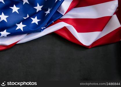 American flag on a dark concrete background. USA national holidays concept. Independence Day, Memorial Day, Labor Day. Place for your text.. American flag on dark concrete background. USA national holidays concept. Independence Day, Memorial Day, Labor Day.