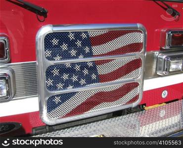 American flag painted on front grill of a truck