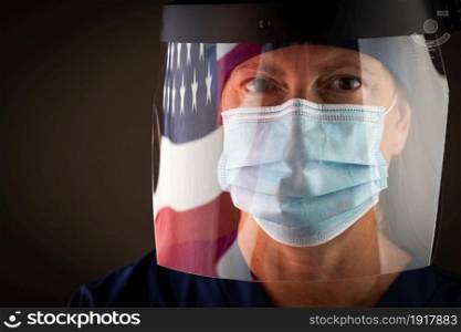 American Flag Reflecting on Female Medical Worker Wearing Protective Face Mask and Shield.