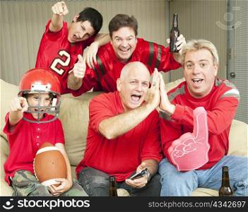 American football fans get together for a super bowl party.