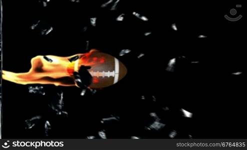 American football on fire breaking glass
