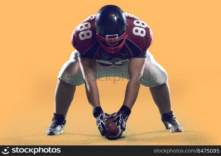 American Football Player isolated on colorfull background. Portrait of a strong muscular American Football Player isolated on colorful background