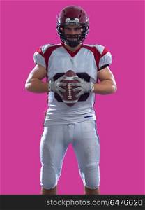 American Football Player isolated on colorfull background. Portrait of a strong muscular American Football Player isolated on colorful background