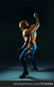 American football player with ball in hand, contact sport. American football player with ball in hand, NFL