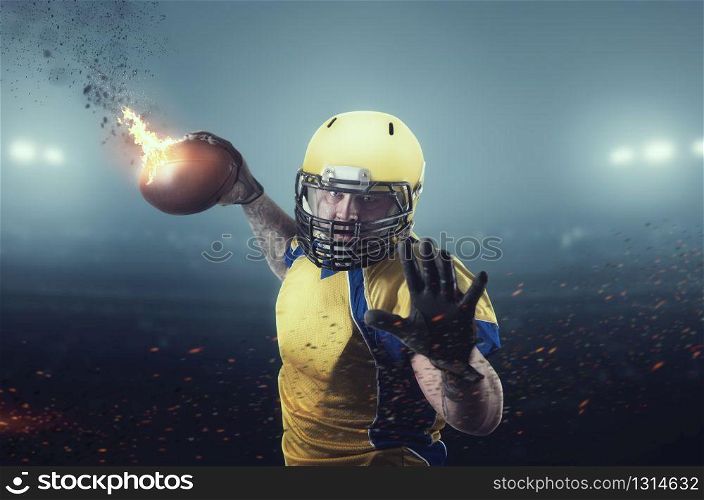 American football player with burning ball on the stadium. National league, men sport. American football player with burning ball