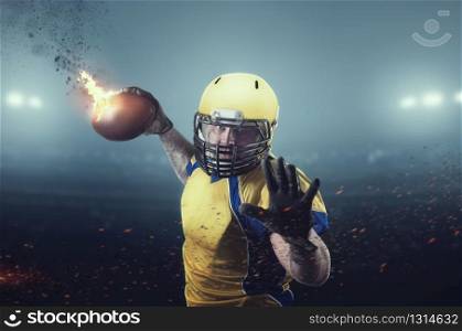 American football player with burning ball on the stadium. National league, men sport. American football player with burning ball