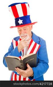 American icon Uncle Sam reading the Bible. Isolated on white.