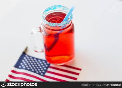 american independence day, celebration, patriotism and holidays concept - close up of juice glass and flag at 4th july party from top