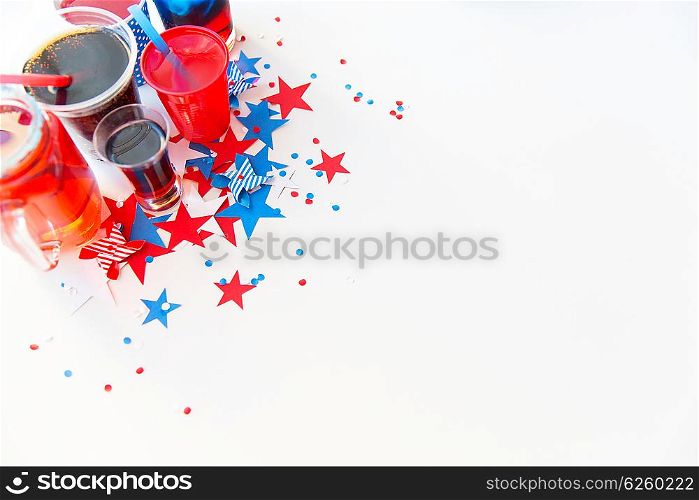 american independence day, celebration, patriotism and holidays concept - close up of cups and glasses with drinks on american independence day party