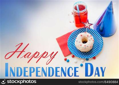 american independence day, celebration, patriotism and holidays concept - close up of glazed sweet donut decorated with star, juice in glass mason jar or mug and candies at 4th july party from top. donut with juice and candies on independence day. donut with juice and candies on independence day