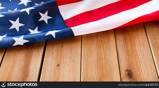 american independence day, patriotism and nationalism concept - close up of american flag on wooden boards