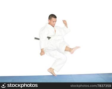 american man in karate suit, suspended in mid air