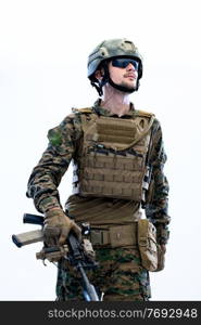 american  marine corps special operations modern warfare soldier with fire arm weapon and protective army tactical gear ready for battle