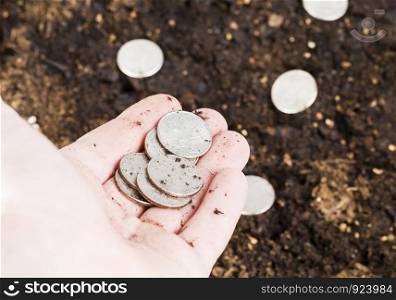 American money scattered on the soil on the field, details on nature, the field of agriculture plowed. American money , field