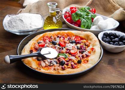american pizza with salami,beans and mais