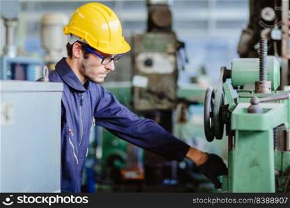 american worker young man.engineer smiling for service maintenance fix machine in heavy industy with safty suit and helmet.