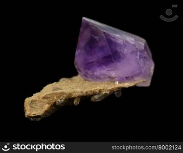 Amethyst crystal from Kazakhstan isolated on a black background