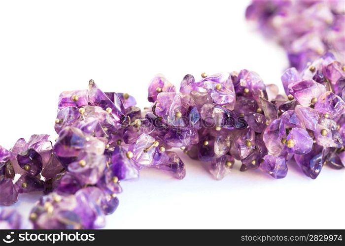 Amethyst necklace isolated on white background.
