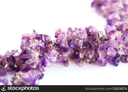 Amethyst necklace isolated on white background.