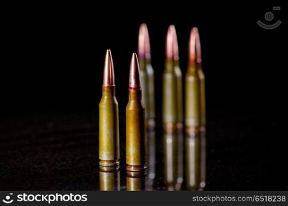 Ammunition cartridges on black background. Ammunition cartridges on black