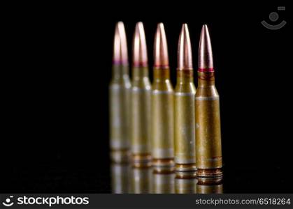 Ammunition cartridges on black background. Ammunition cartridges on black