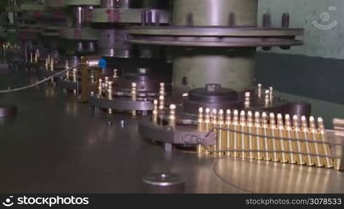 Ammunition factory , bullets for rifle on production line