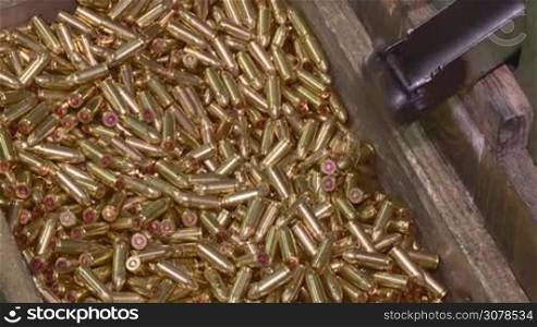 Ammunition factory , bullets for rifle on production line