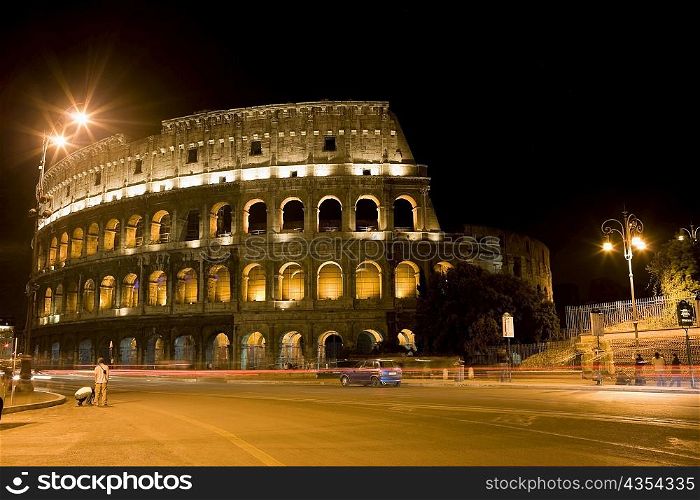 Amphitheater lit up at night, Coliseum, Rome, Italy