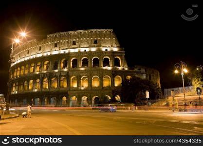 Amphitheater lit up at night, Coliseum, Rome, Italy