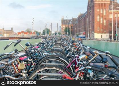 Amsterdam. Bicycle parking in the city center.. Large bicycle parking near the central train station in Amsterdam.
