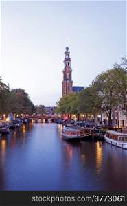 Amsterdam by night with the Westerkerk in the Netherlands