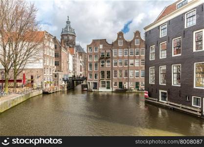 Amsterdam Canals and Saint Nicholas church Netherlands