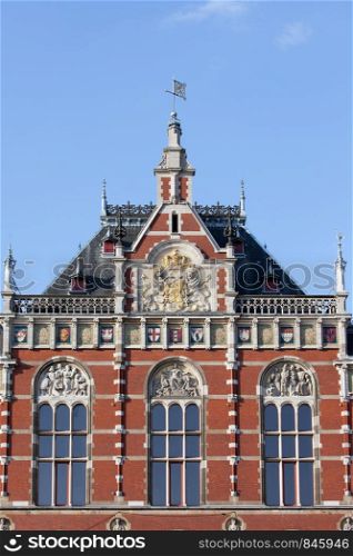 Amsterdam Central Station architectural details in Holland, Netherlands, 19th century Neo-Renaissance and Neo-Gothic style.