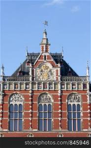 Amsterdam Central Station architectural details in Holland, Netherlands, 19th century Neo-Renaissance and Neo-Gothic style.