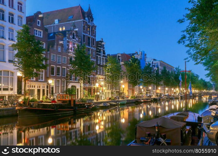 Amsterdam. City Canal at dawn.. City Canal with glowing lights early in the morning. Amsterdam. Netherlands.