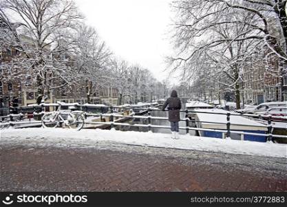 Amsterdam covered with snow in winter in the Netherlands