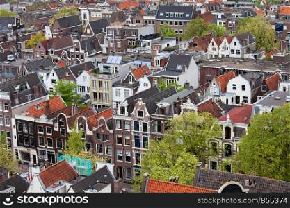 Amsterdam from above, apartment buildings, historic houses of the old city quarter, Holland, Netherlands.