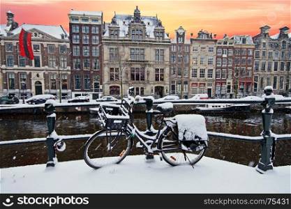 Amsterdam in winter in the Netherlands at sunset